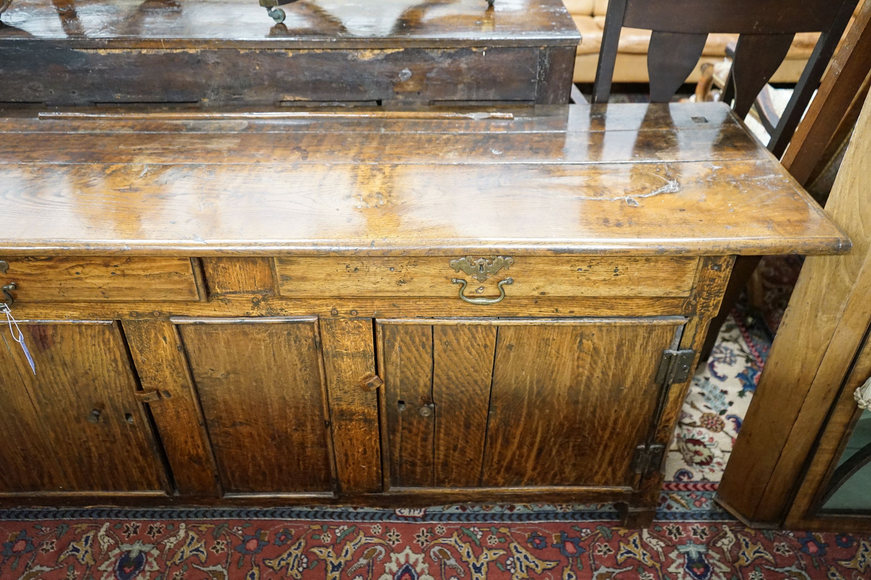 An 18th century and later oak low dresser, length 182cm, depth 52cm, height 75cm